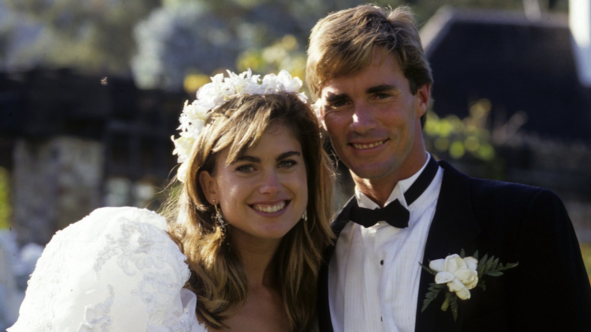 Kathy Ireland and Greg Olsen standing together during their wedding celebration