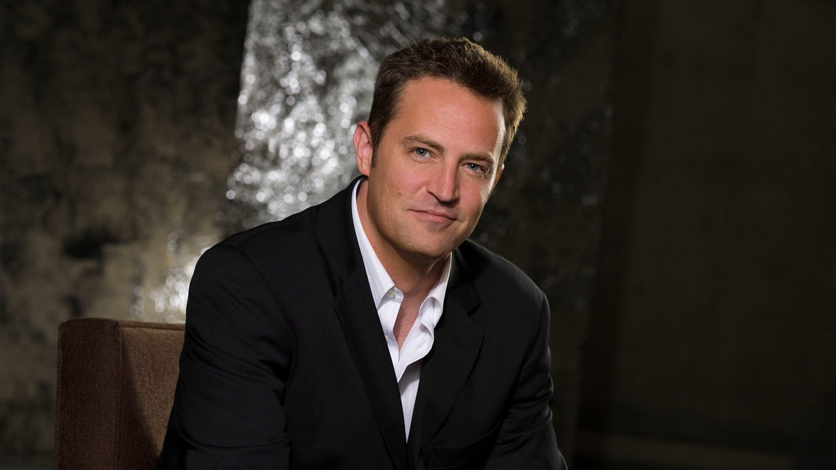 Matthew Perry posing for a photo as Matt Albie