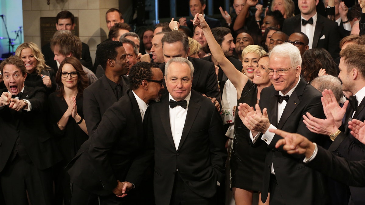 Lorne Michaels at the "Saturday Night Live" 40th anniversary surrounded by stars Martin Short, Tina Fey, Miley Cyrus, Chris Rock, Molly Shannon and Steve Martin
