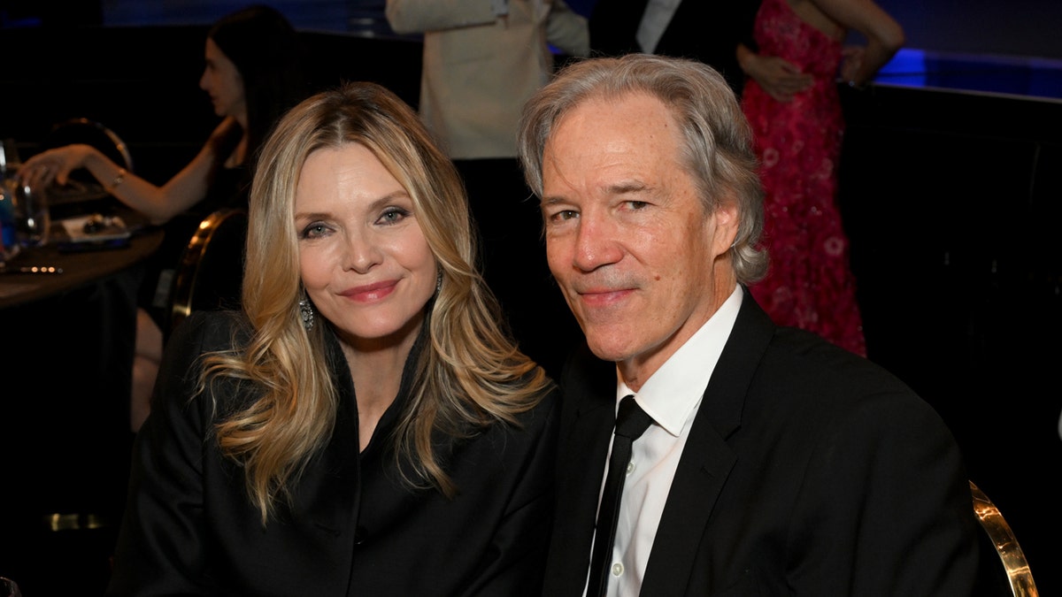 Michelle Pfeiffer and David E. Kelley standing together at Dolby Theatre in Los Angeles