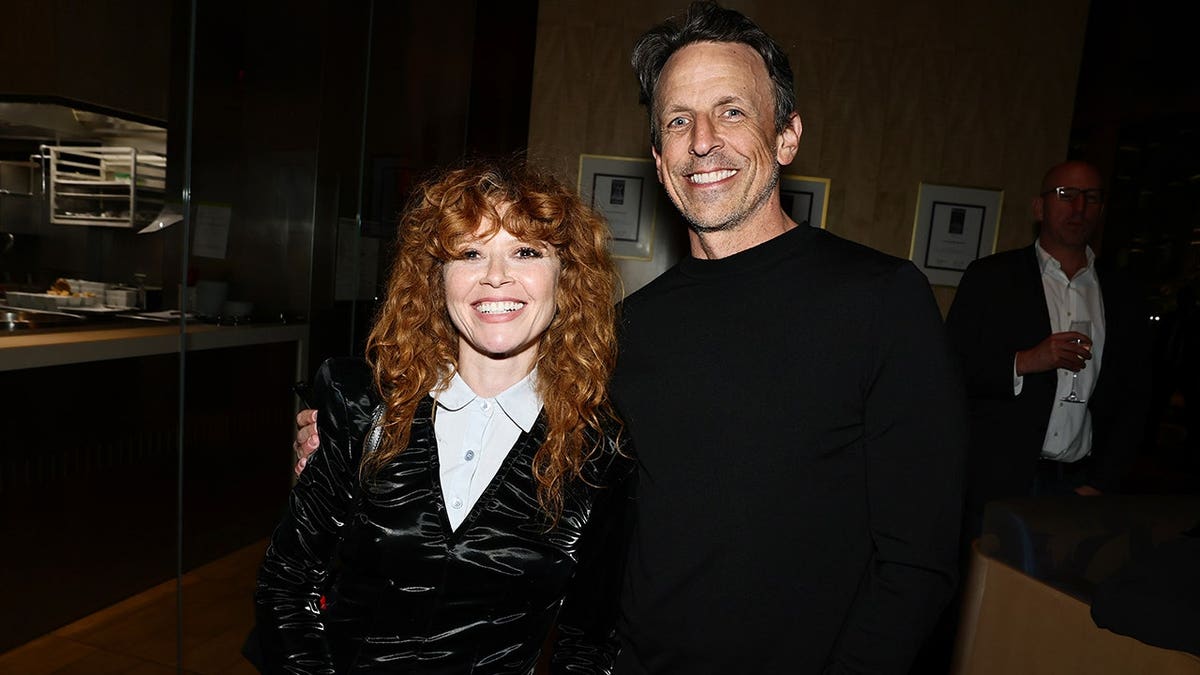 Natasha Lyonne and Seth Meyers standing together at a premiere event in New York City