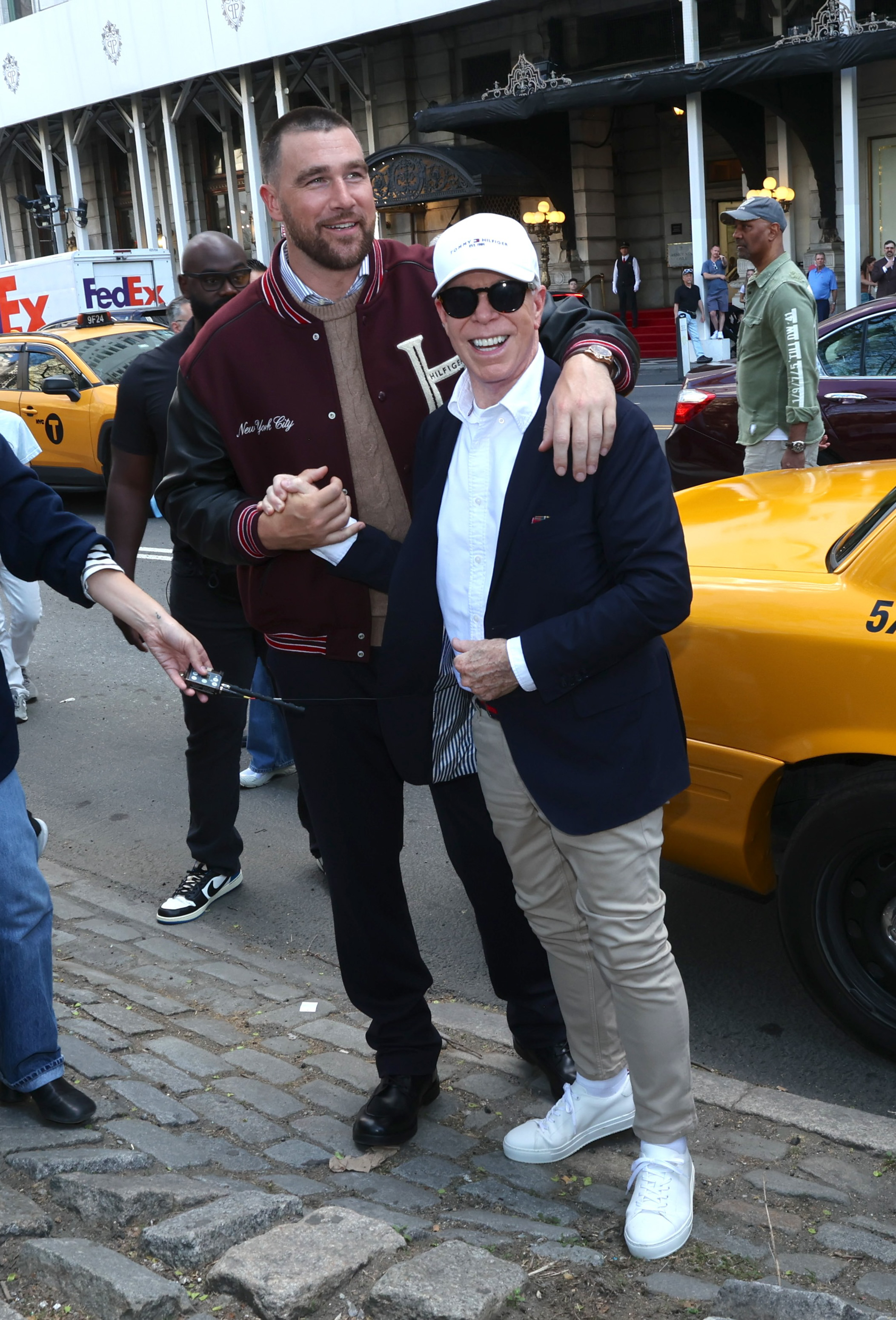 Travis Kelce and Tommy Hilfiger meet up while on the set of a photo shoot in NYC.