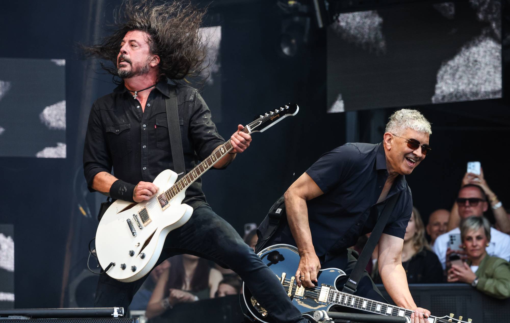 Watch Dave Grohl and Pat Smear surprise fan singing 'Monkey Wrench' at Foo Fighters album launch party