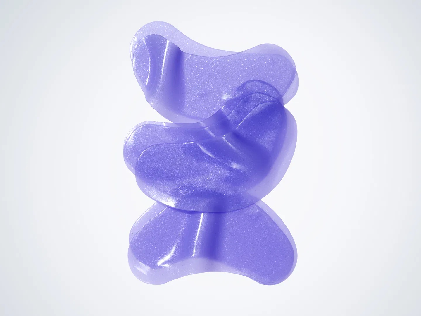 Stack of three purple eye masks with reflections.