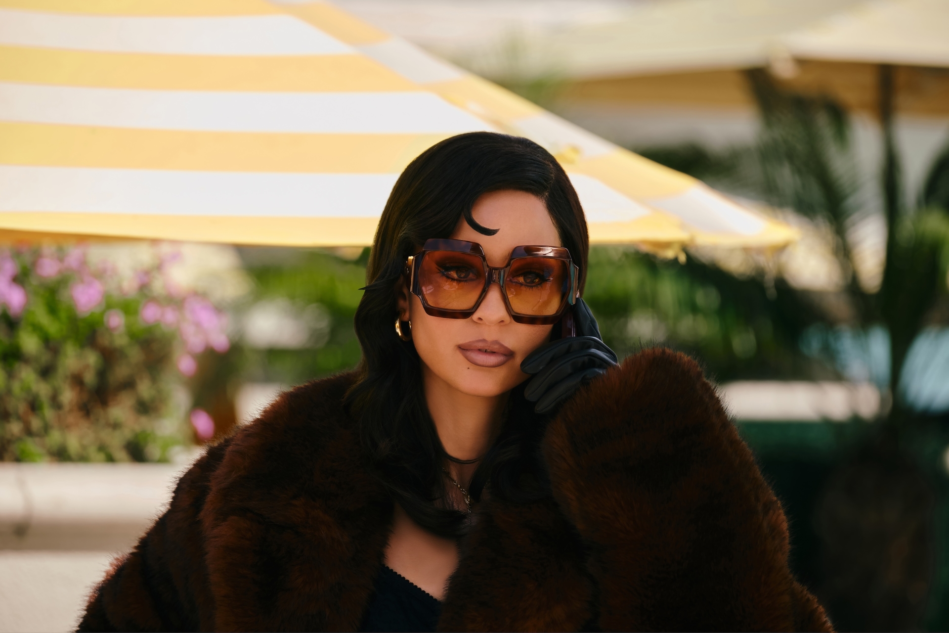 Alexa Demie as Maddy Perez from Euphoria in a brown fur coat and large sunglasses.
