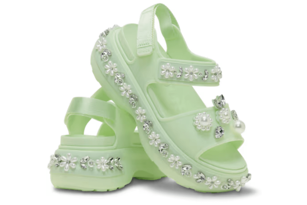 Pair of light green platform sandals with pearl and rhinestone floral embellishments.
