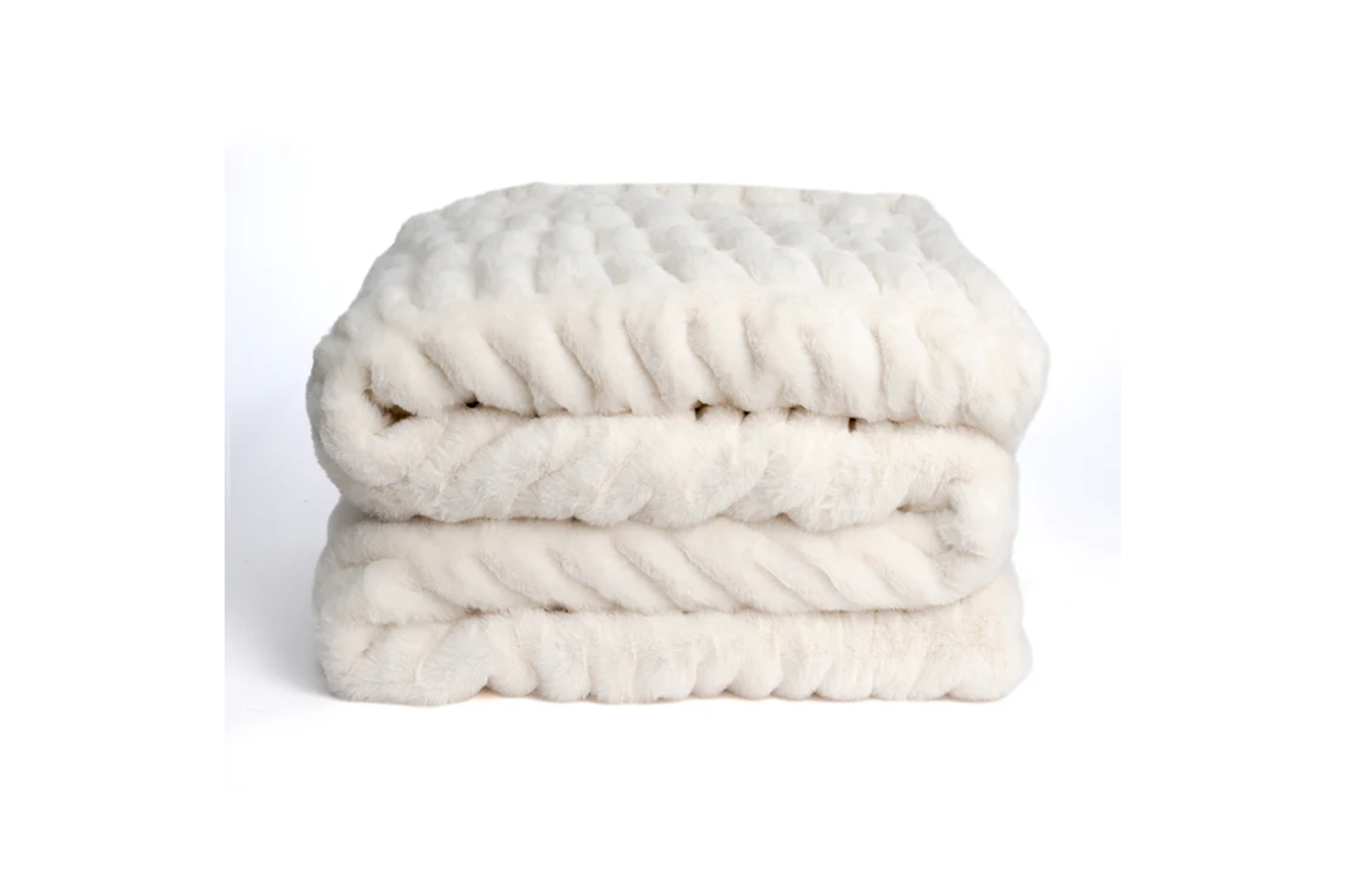 Cream-colored cable knit faux fur blanket.