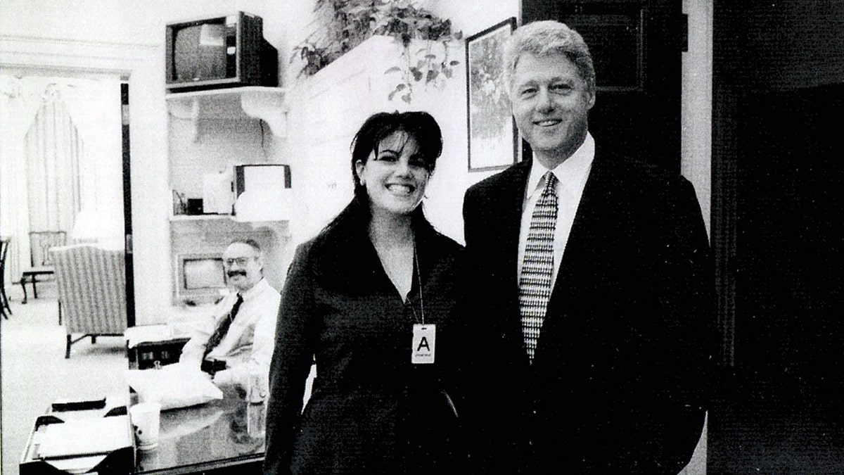 Monica Lewinsky standing next to President Bill Clinton