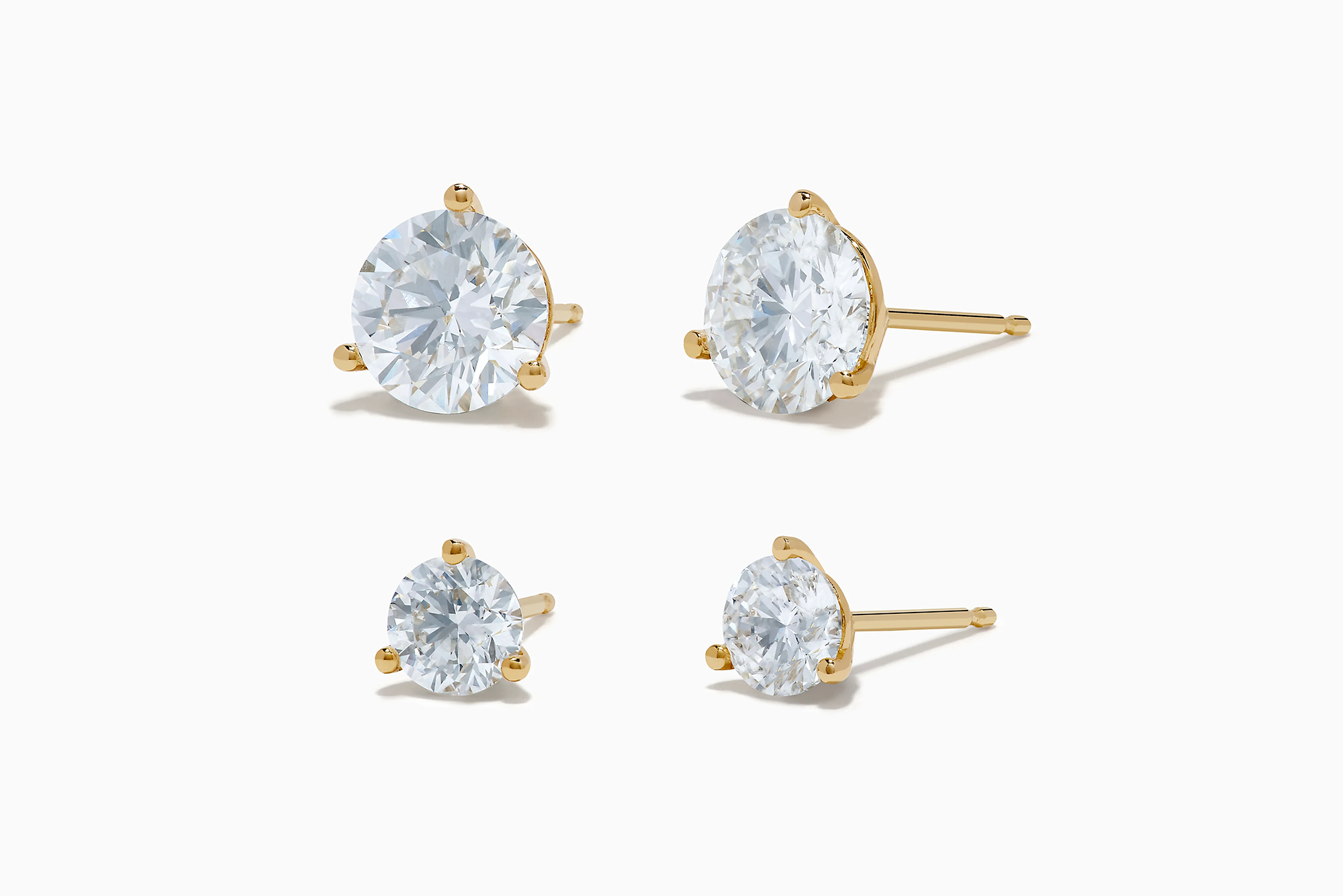 A pair of Effy lab-grown diamond stud earrings, displayed in two sizes, shown from the front and side.