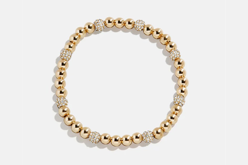 Gold beaded bracelet with clear crystal accents.