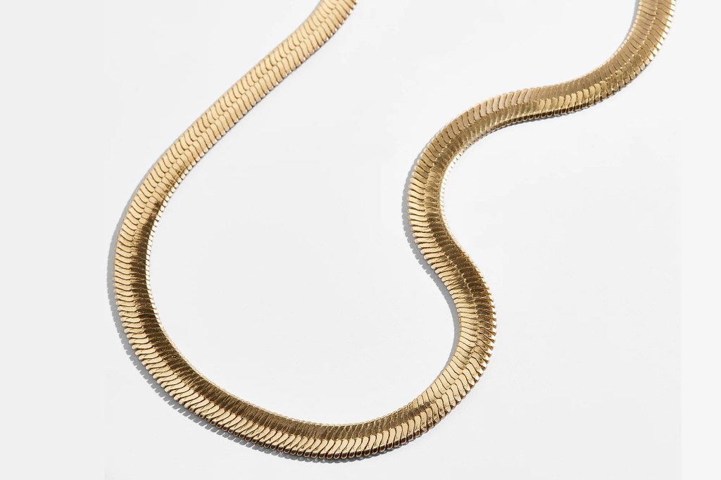 Gold herringbone chain necklace.