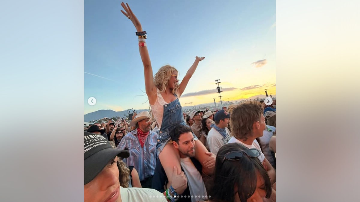 Sydney Sweeney on Scooter Braun's shoulders while at Stagecoach in April 2026.