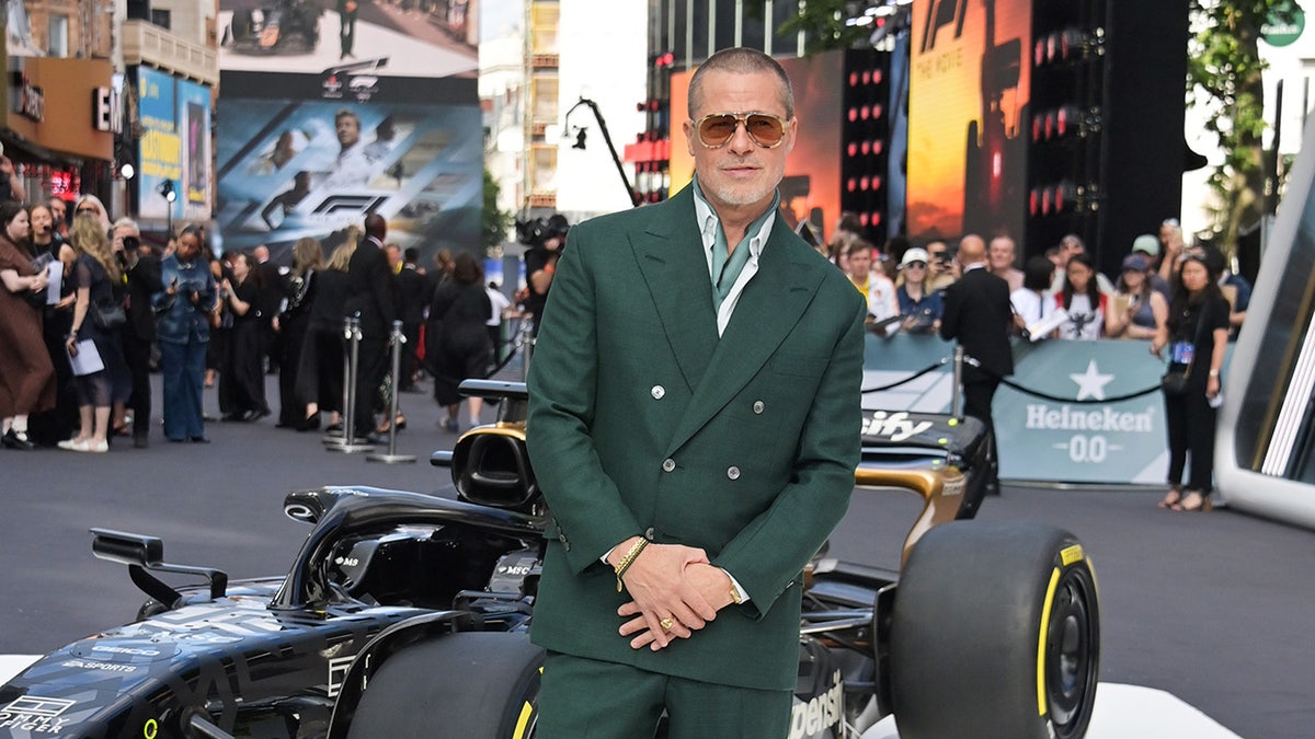 Brad Pitt standing at the European premiere of F1: The Movie in London