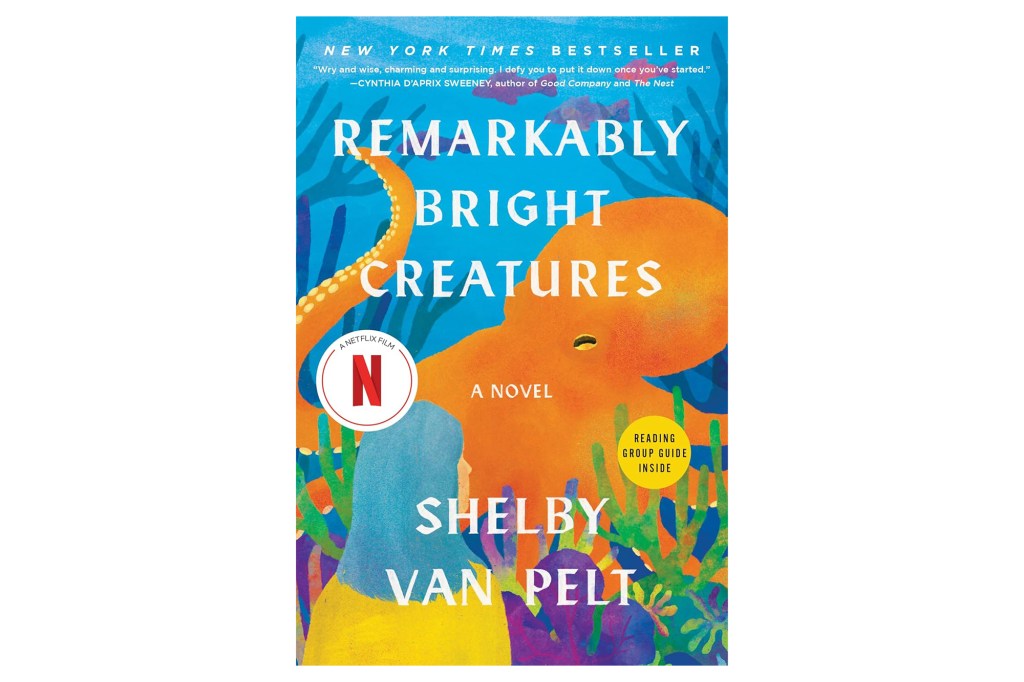 Illustration of the book cover for "Remarkably Bright Creatures" by Shelby Van Pelt, featuring an orange octopus and a woman with blue hair, set against a blue background with colorful coral.