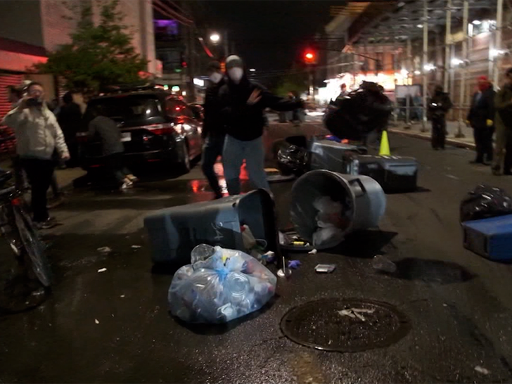 050326_ice_drags_man_throw_trash_primary