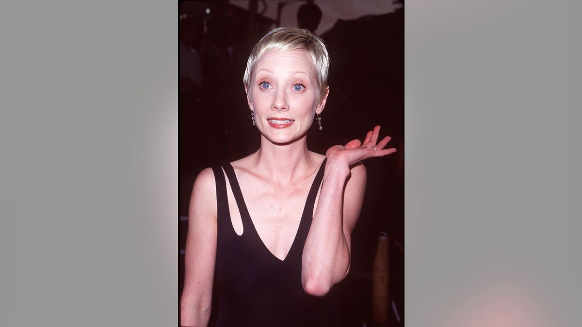 Anne Heche standing at the Return to Paradise premiere in Westwood, California