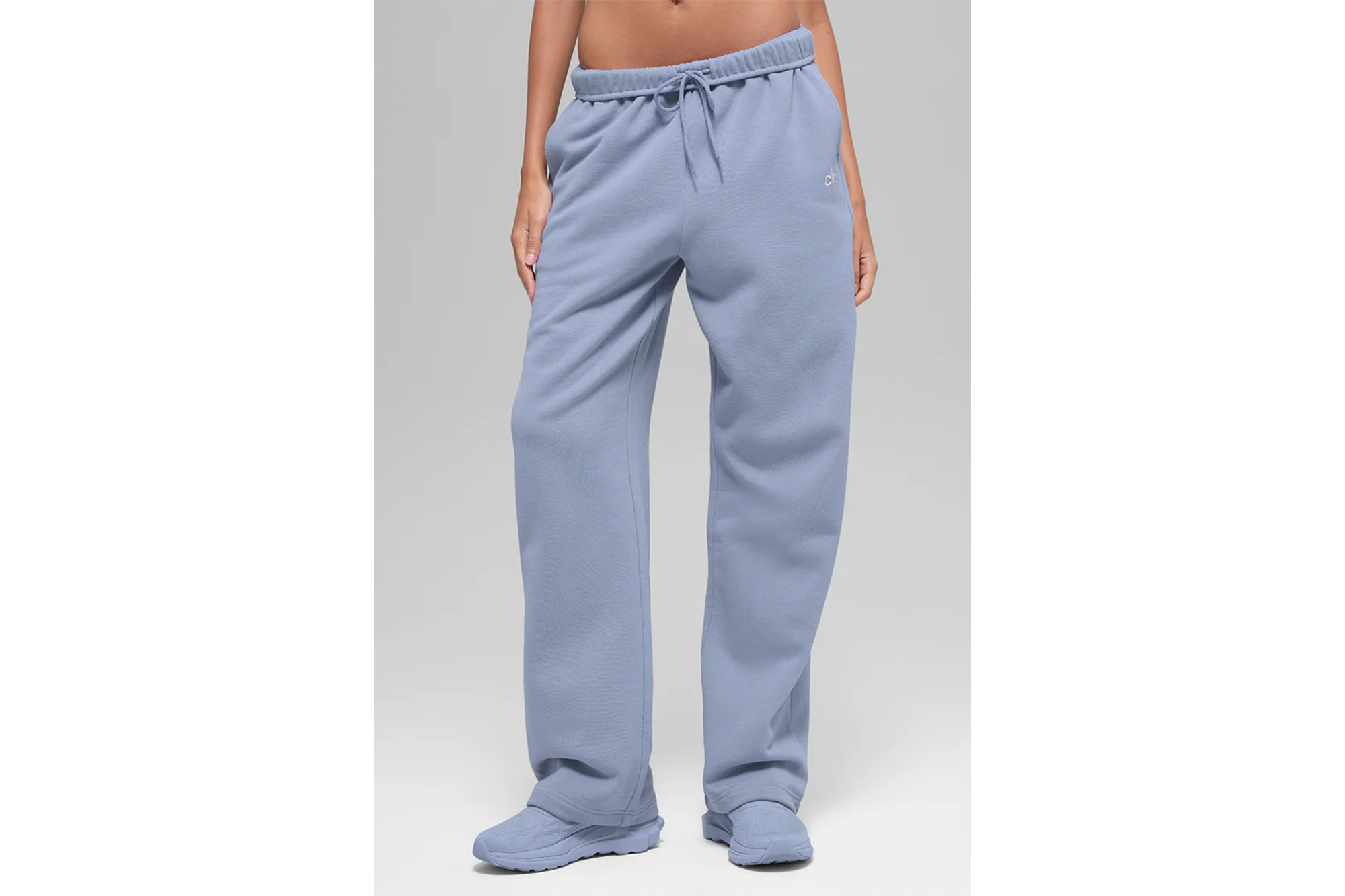 Light blue sweatpants with elastic waist and drawstring.