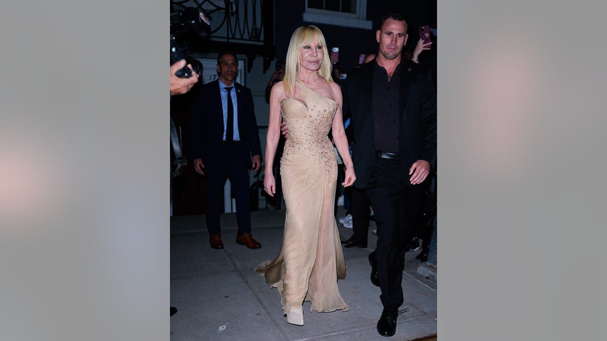 Donatella Versace standing at Anna Wintour's pre-Met Gala Party in New York City