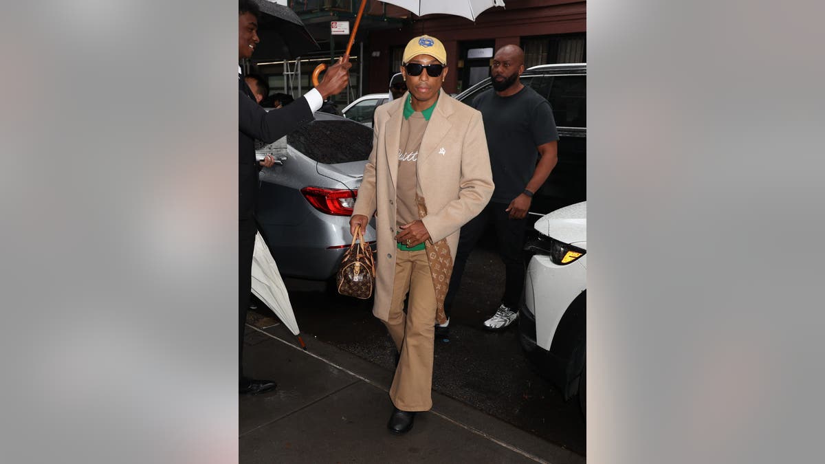 Pharrell Williams arriving at Anna Wintour's pre-Met Gala party in New York City