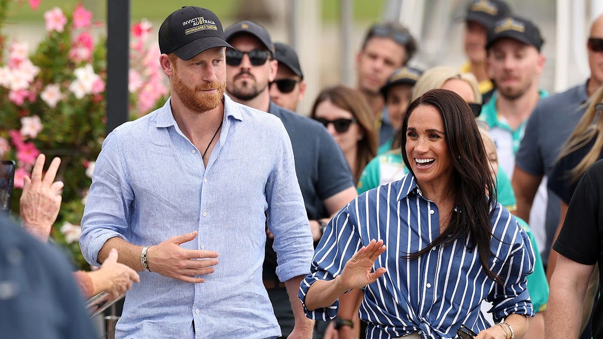 Prince Harry and Meghan, Duchess of Sussex, greeting public at Cruising Yacht Club of Australia in Sydney