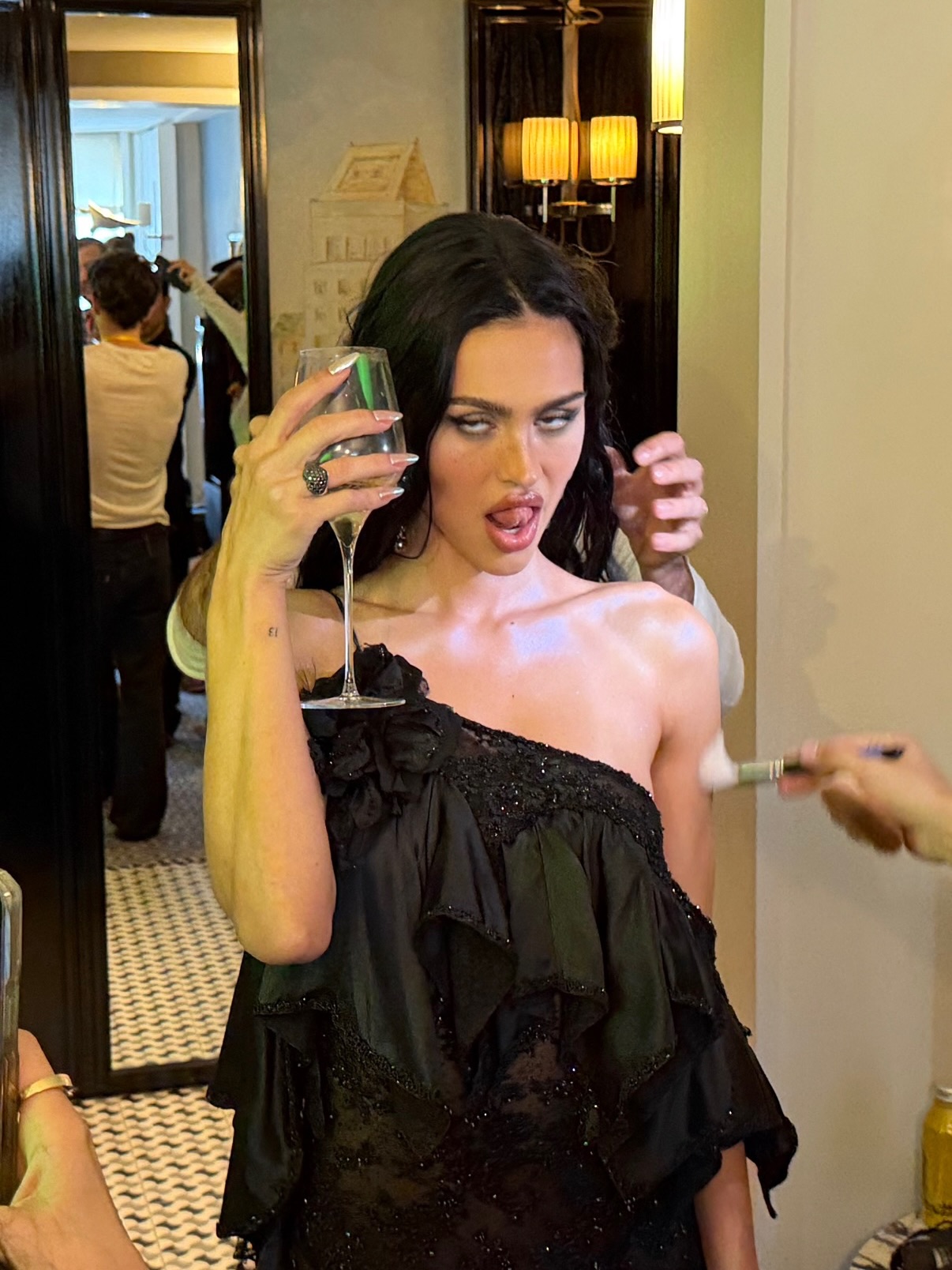 Amelia Gray Hamlin sips champagne while getting ready for the Met Gala.