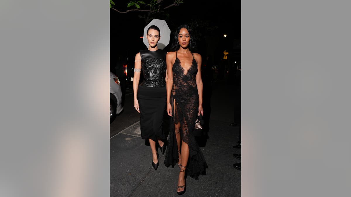 Vittoria Ceretti and Laura Harrier standing together at the Saint Laurent Met Gala after party