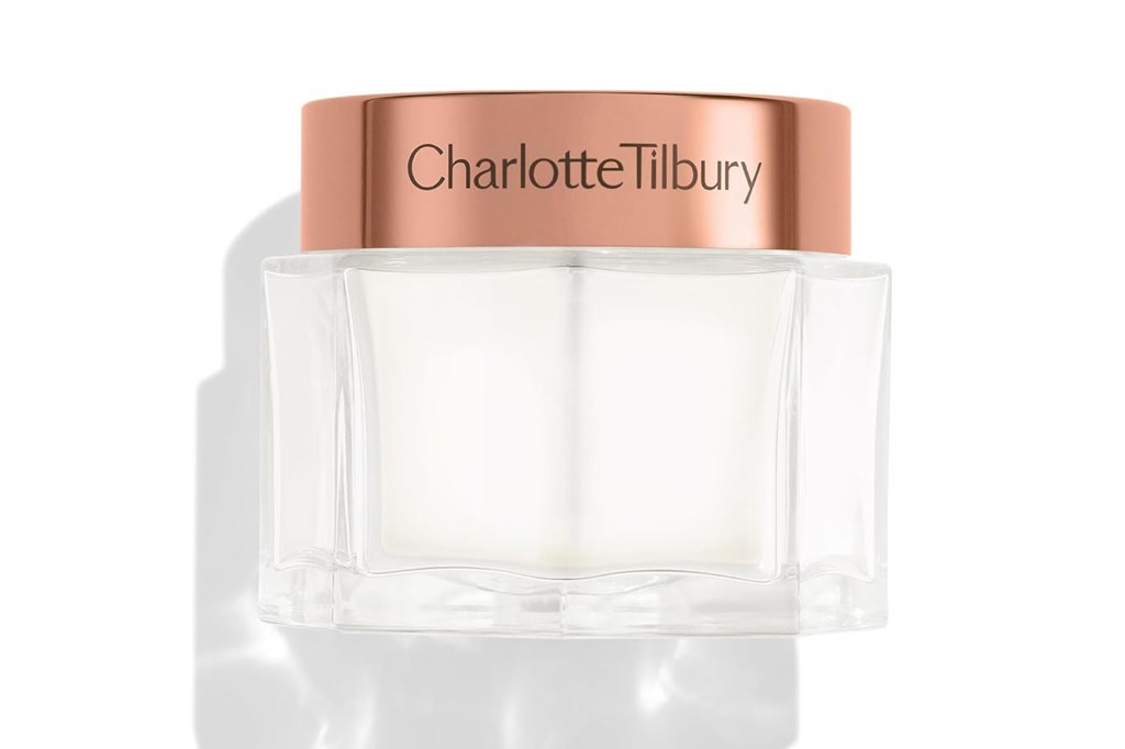 Charlotte Tilbury cream in a clear glass jar with a rose gold lid.