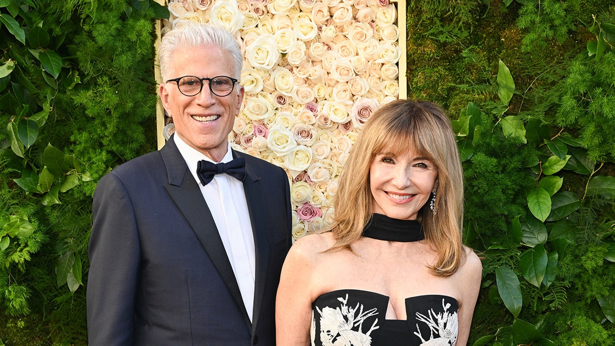 Ted Danson and Mary Steenburgen posing together on the red carpet at the Golden Globes