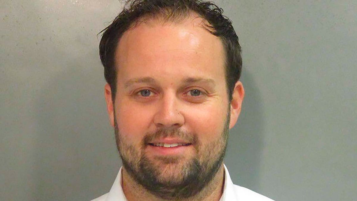 Josh Duggar facing forward in a mugshot photo