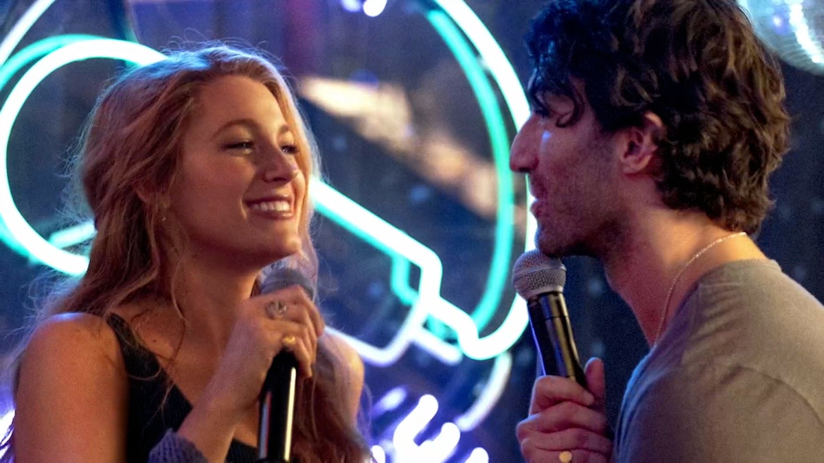 Justin Baldoni and Blake Lively standing together at an event