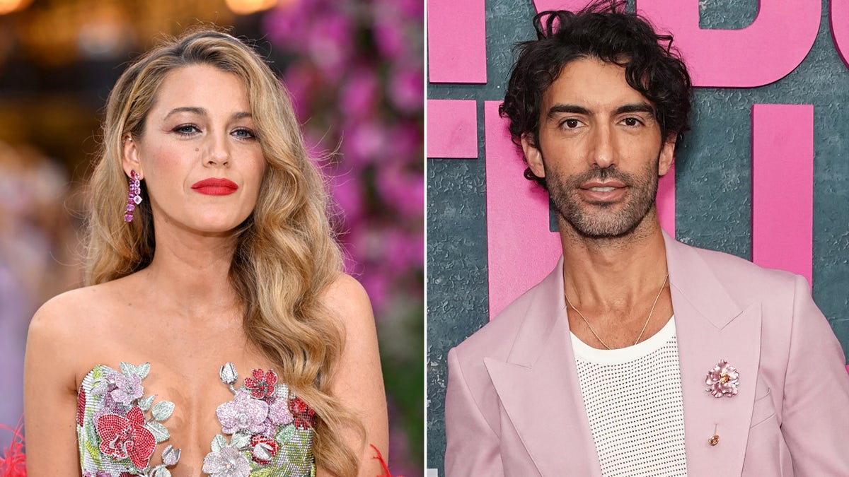 Actress Blake Lively wearing strapless floral dress walking red carpet next to Justin Baldoni in pink suit