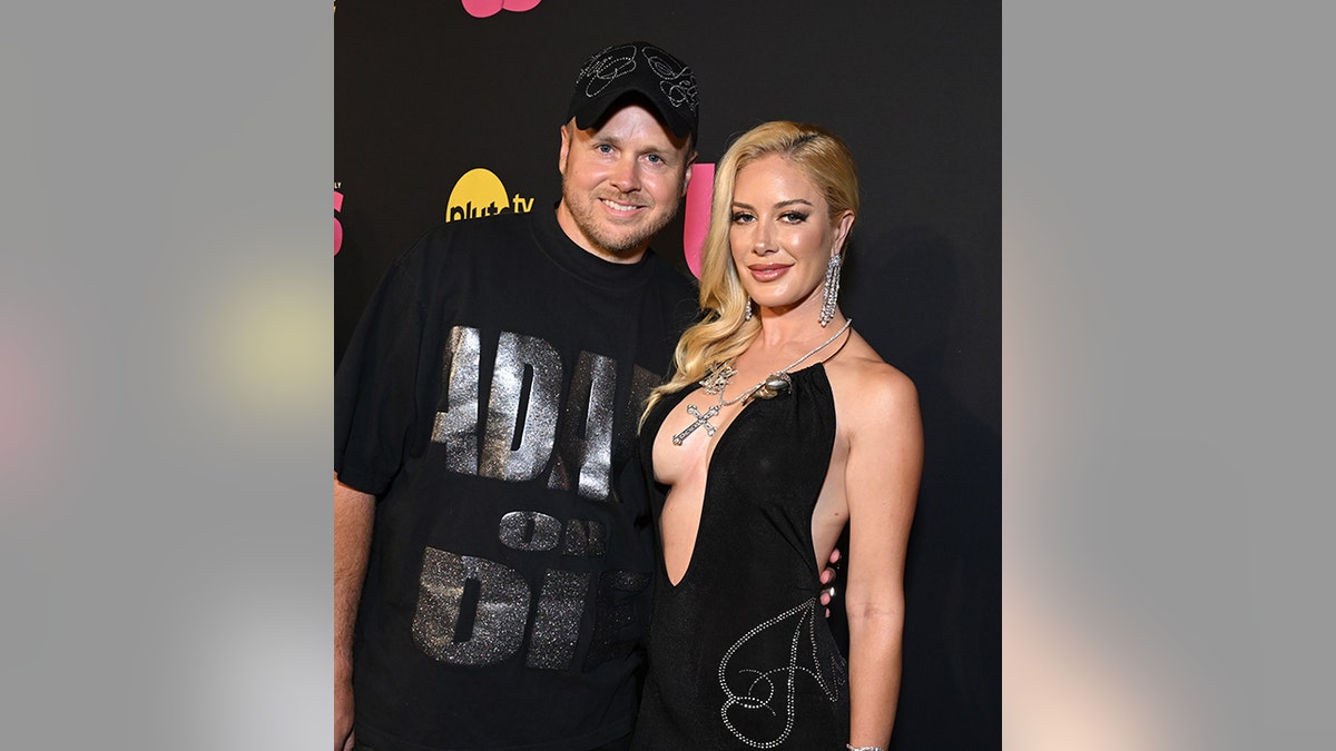 Spencer Pratt and Heidi Montag smiling on the red carpet at an event in Los Angeles