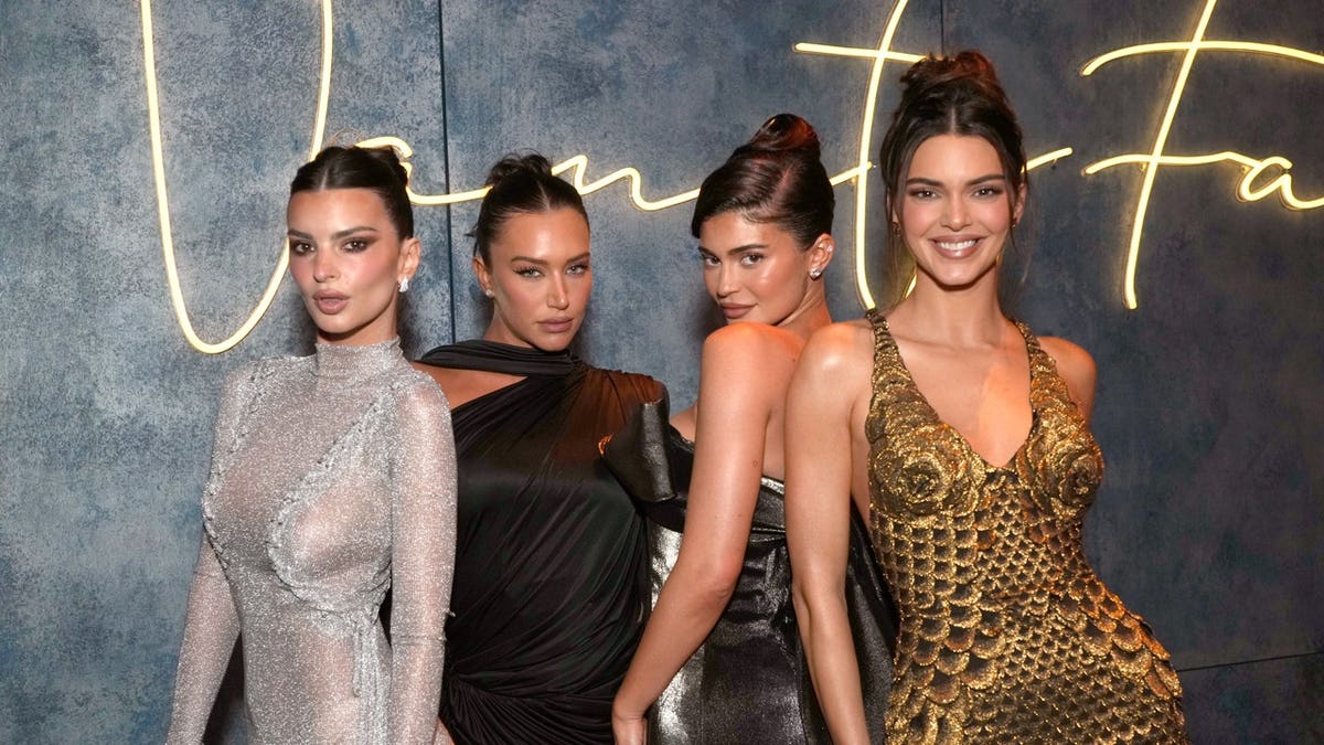 Kylie Jenner and Stassie Karanikolaou with friends at an event in 2023