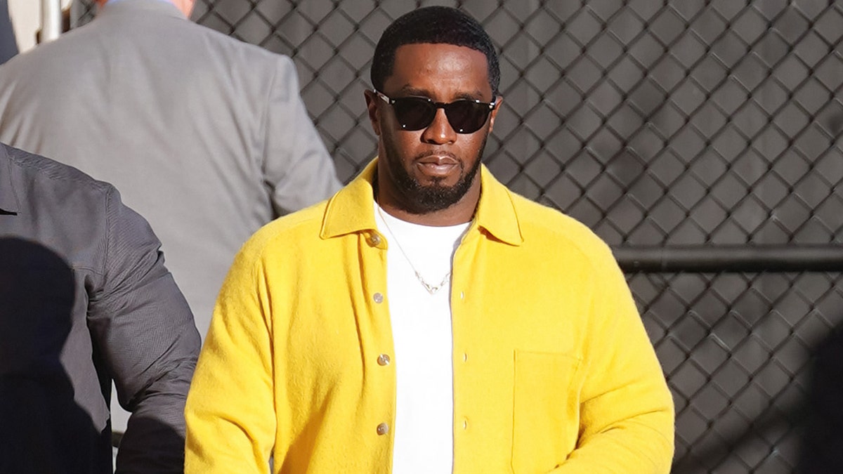 Sean Diddy Combs arriving at Jimmy Kimmel Live show in Los Angeles wearing yellow button-up over white shirt