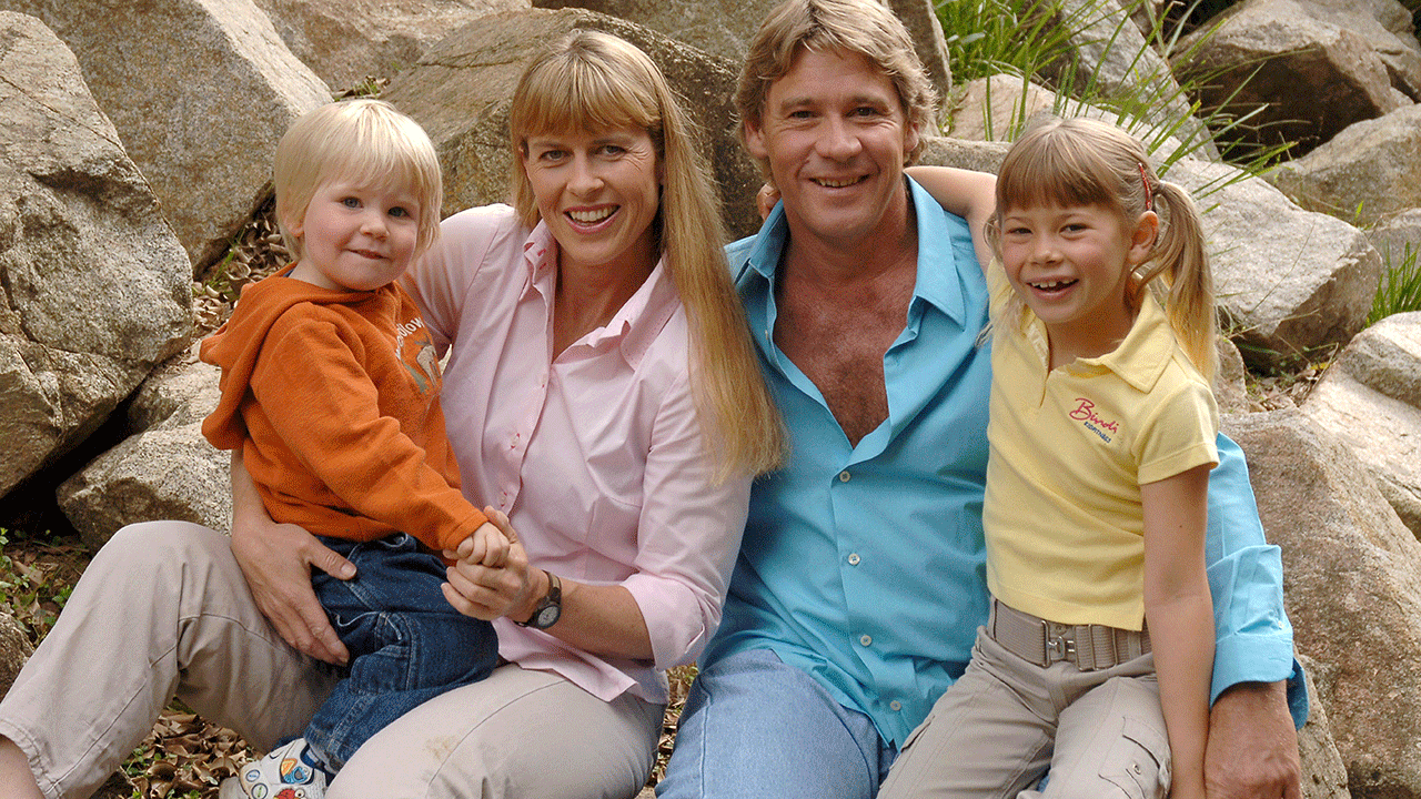 Steve Irwin and family posing outdoors at Australia Zoo