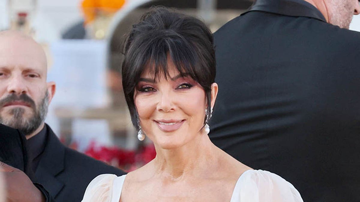 Kris Jenner smiling while boarding a water taxi in Venice, Italy