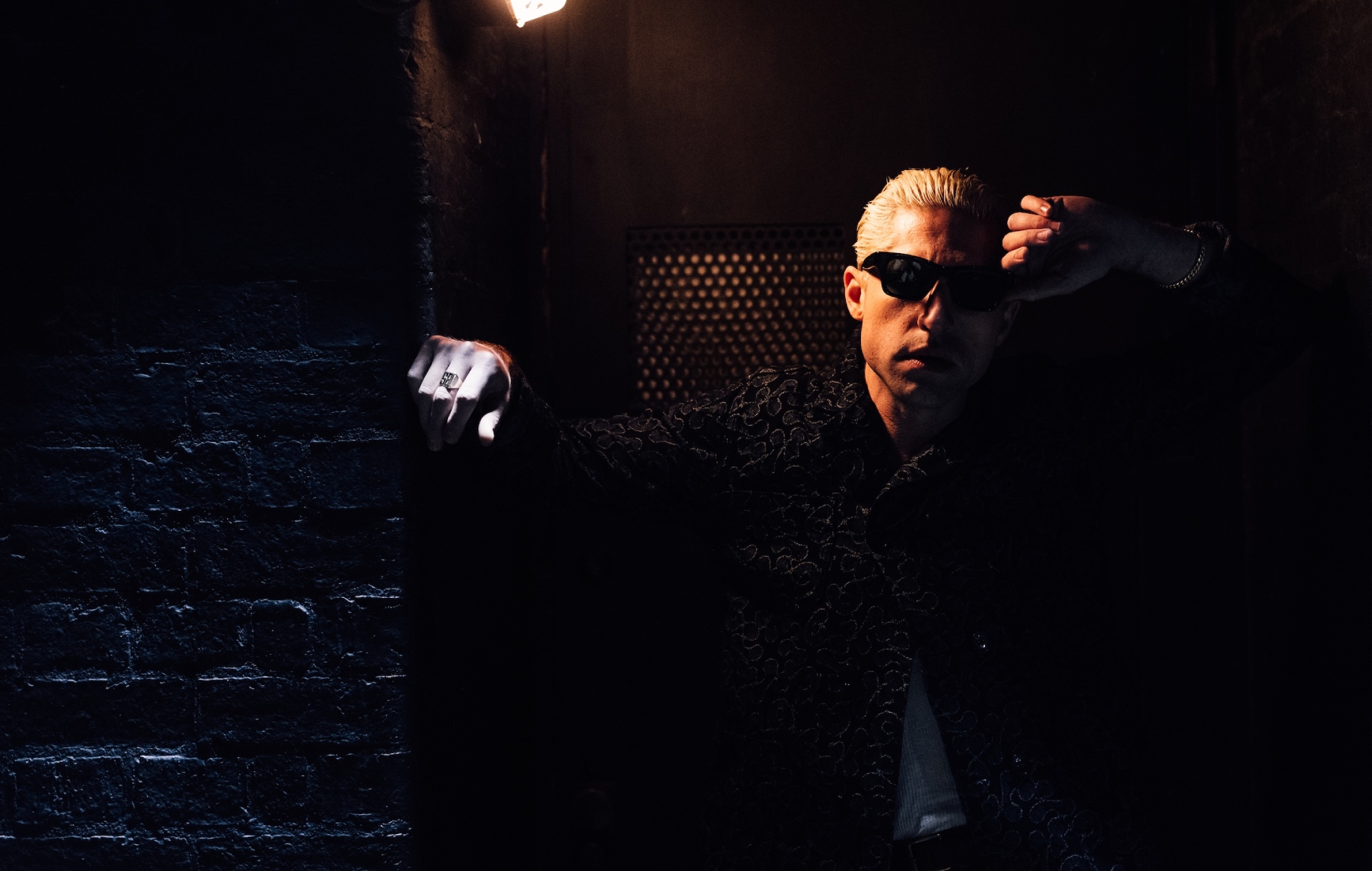 Queens Of The Stone Age's Michael Shuman shares summer-ready new single ‘LA’ featuring Lily James