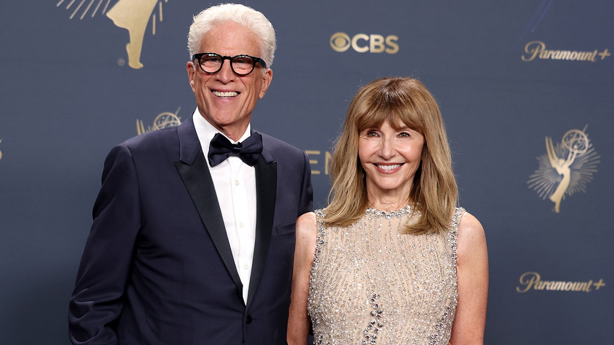 Ted Danson and Mary Steenburgen posing in the press room at the Primetime Emmy Awards.