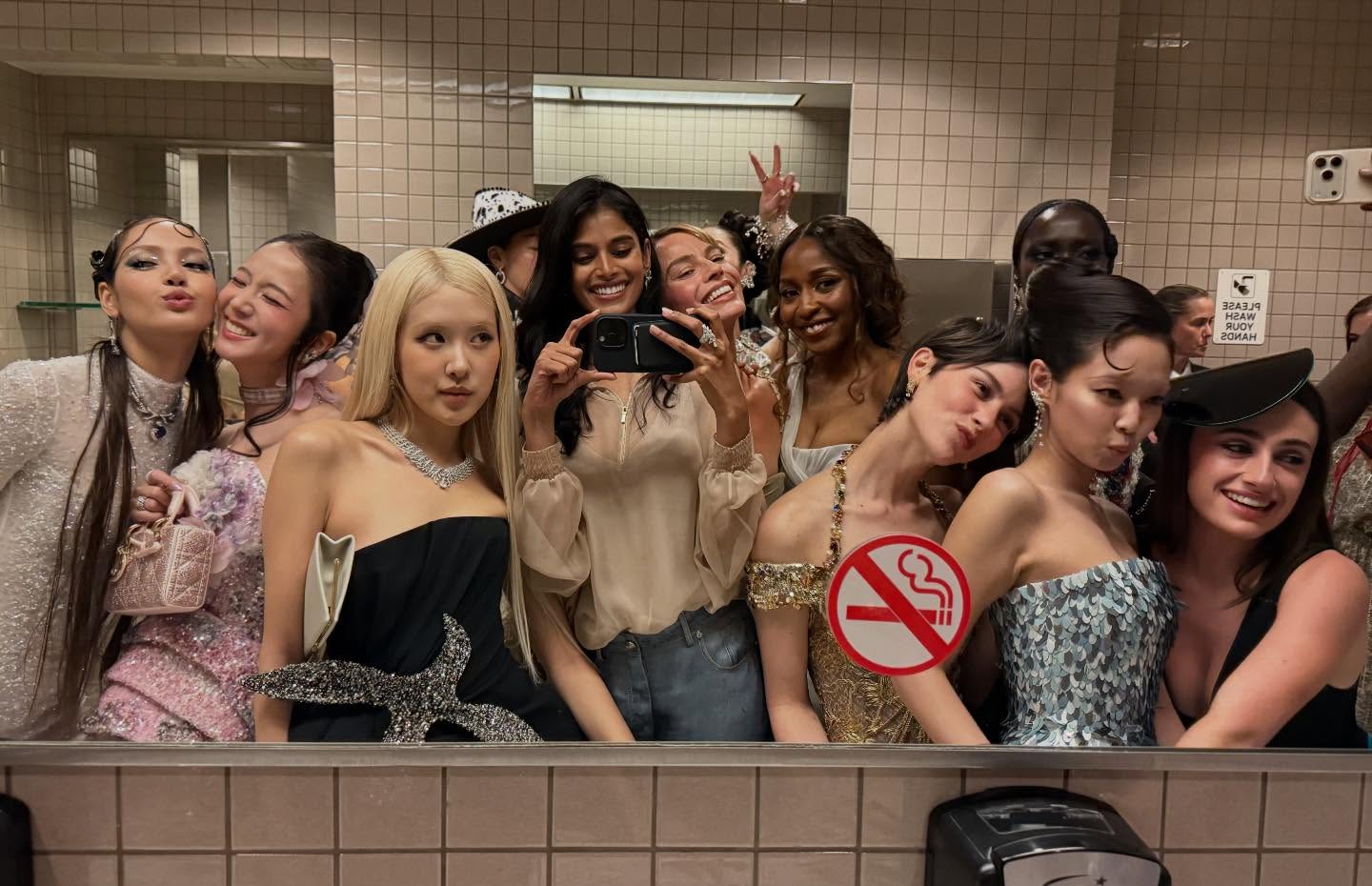 Margot Robbie, Rachel Sennott, Gracie Abrams, Lisa, Rose, and Ayo Edebiri snap a bathroom selfie at the Met Gala.